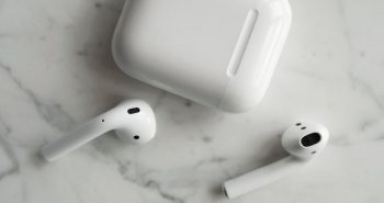 White wireless earbuds and charging case