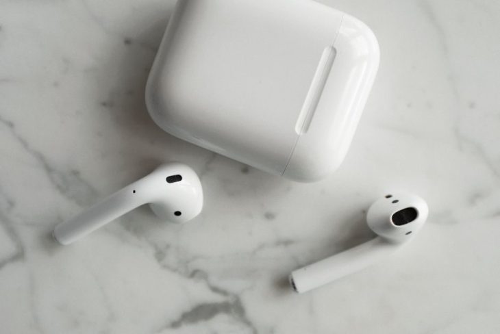 White wireless earbuds and charging case