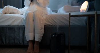 Humidifier releasing mist in a bedroom