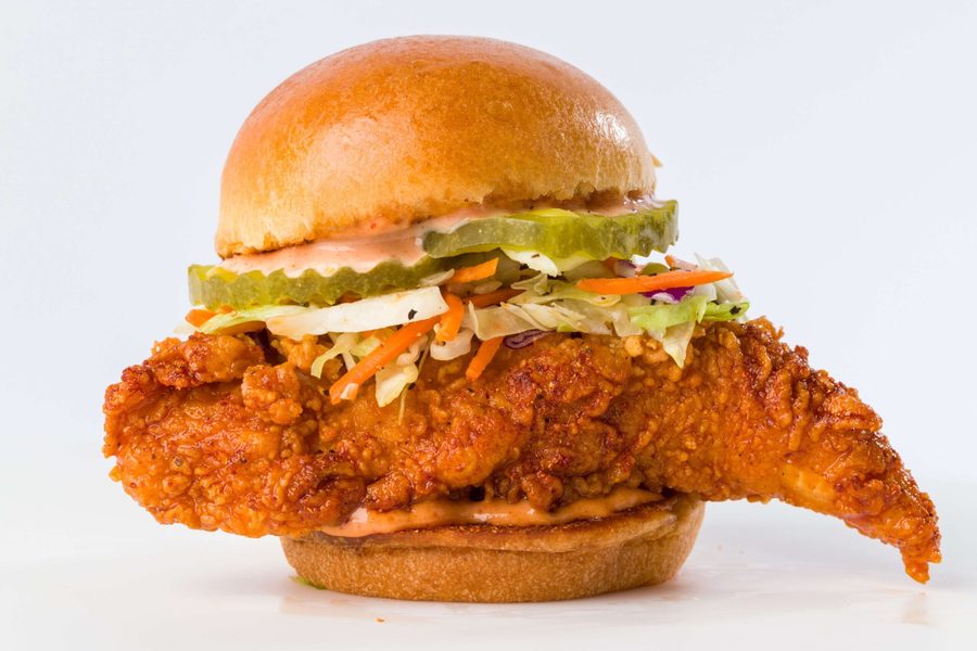 Crimson Coward Nashville hot chicken slider on a brioche bun