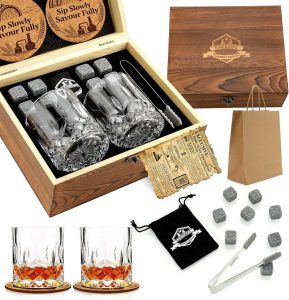 Whiskey stones and two crystal whiskey glasses in a wooden gift box