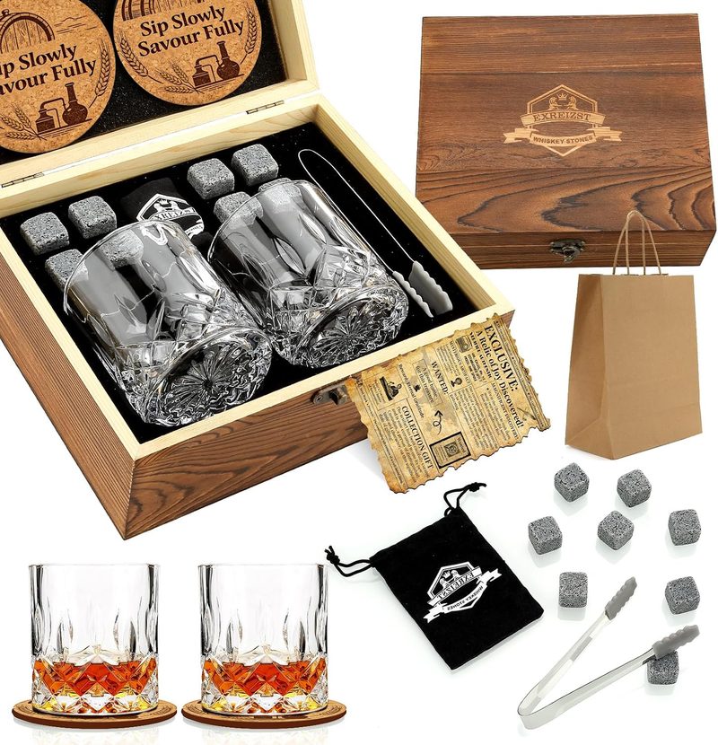 Whiskey stones and two crystal whiskey glasses in a wooden gift box